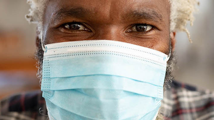 A man wearing a medical mask.