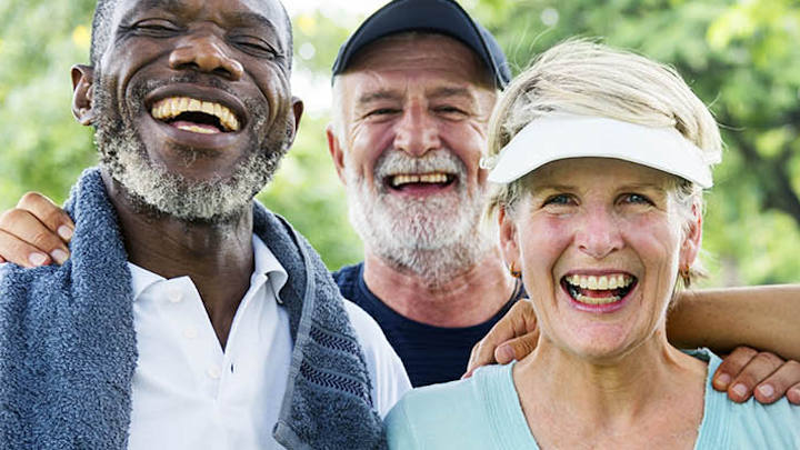 A group of older people exercising. A group of older people exercising.